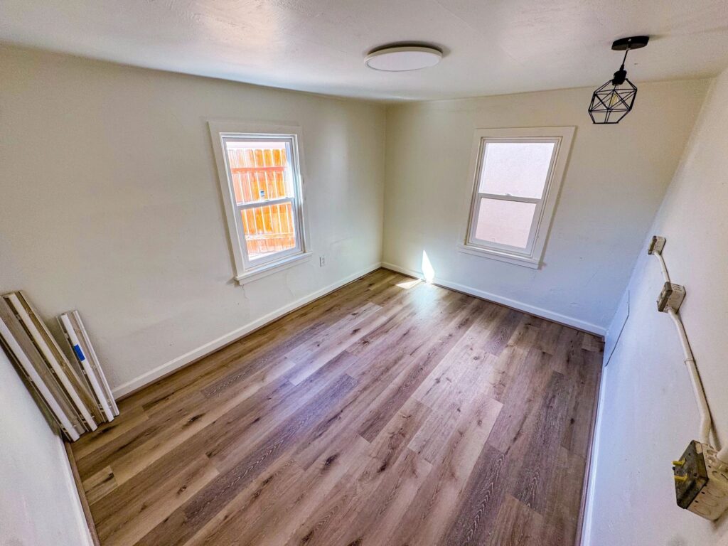 Empty Bedroom Interior With Wood-Look Flooring in Affordable Housing